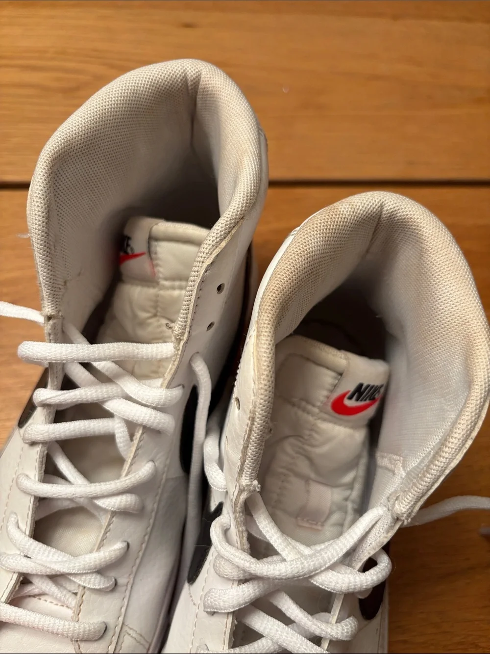 Nike Blazers High-Top Sneakers in White with Black Swoosh
